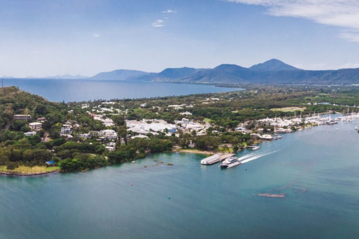 a large body of water with a mountain in the background
