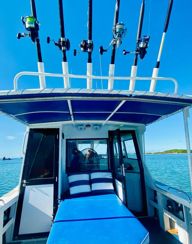 a boat is docked next to a body of water